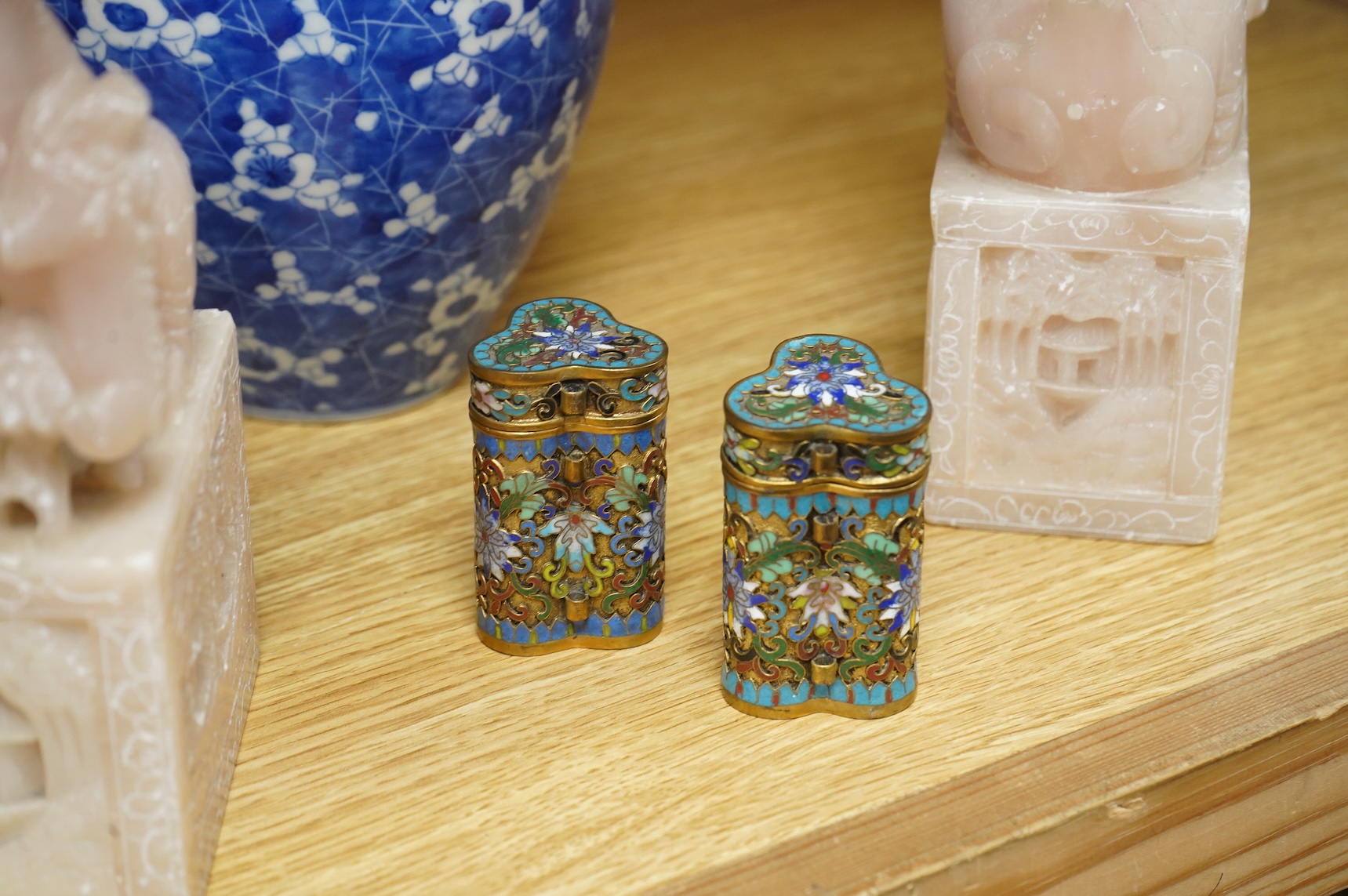 A pair of Chinese soapstone lion-dogs - 22.5cm high, two cloisonné enamel boxes and covers and a blue & white jar & cover